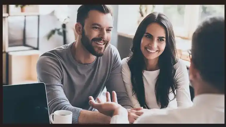 A Quantum Finance advisor in a consultation with a couple